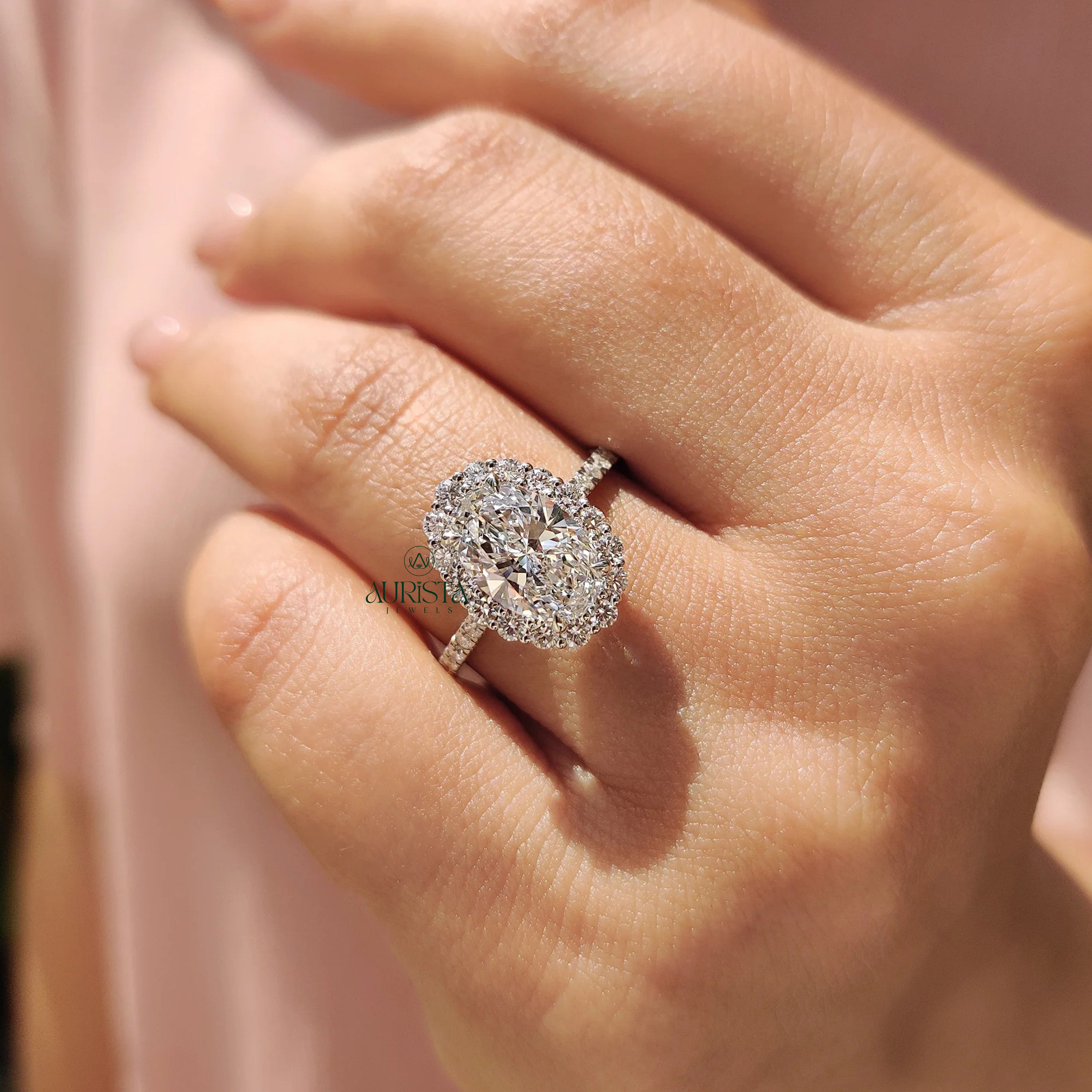 Oval Cut Diamond Halo Ring with Twisted Infinity Band