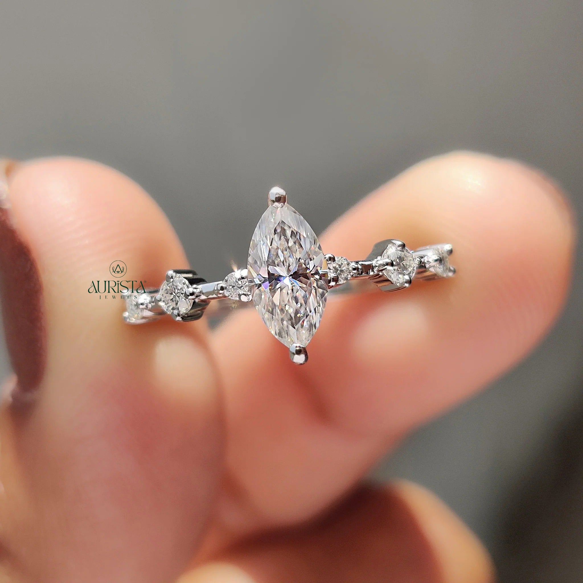 Marquise Moissanite Engagement Ring with Diamond Side Stones in White Gold Band