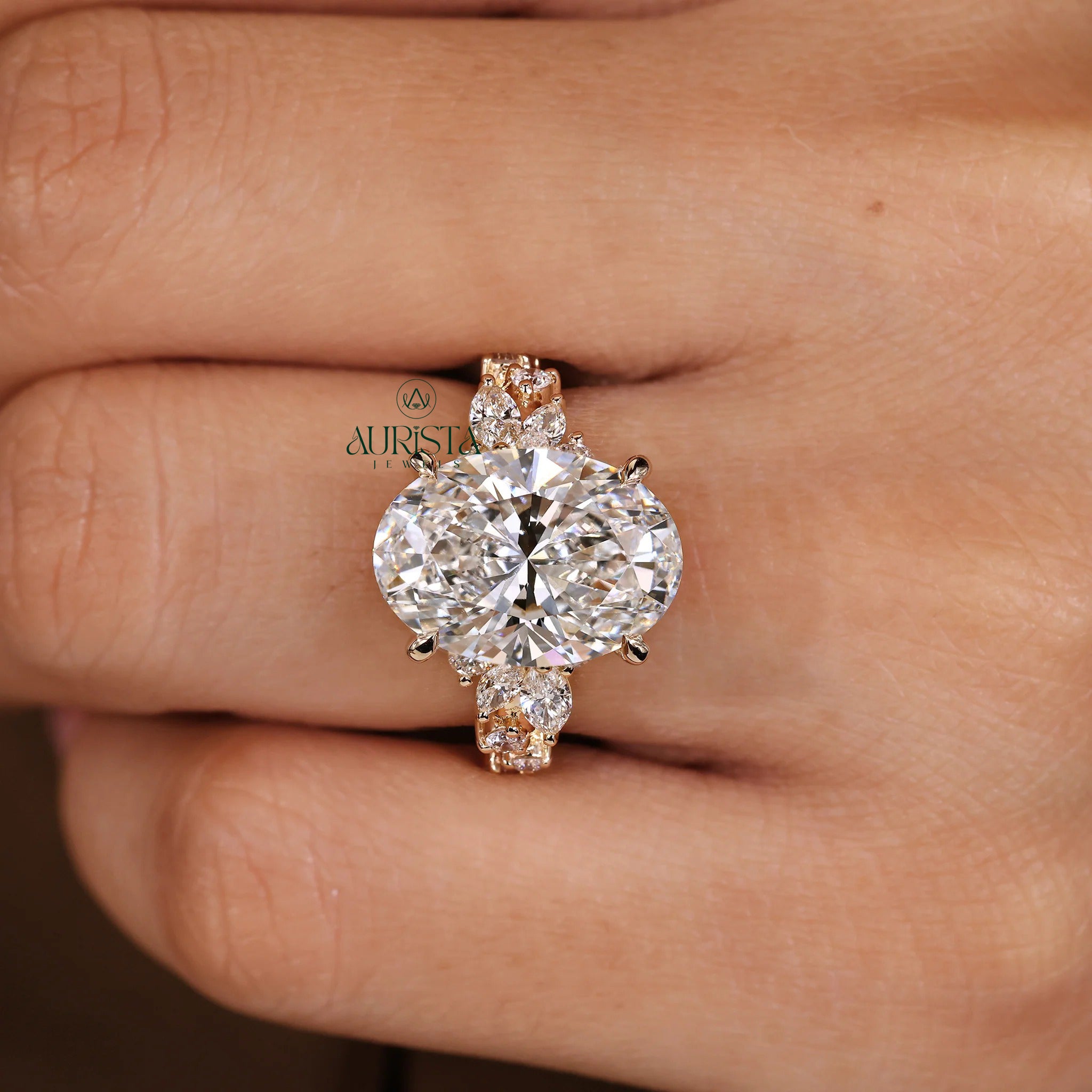 Oval Cut Diamond Ring with Marquise Side Stones
