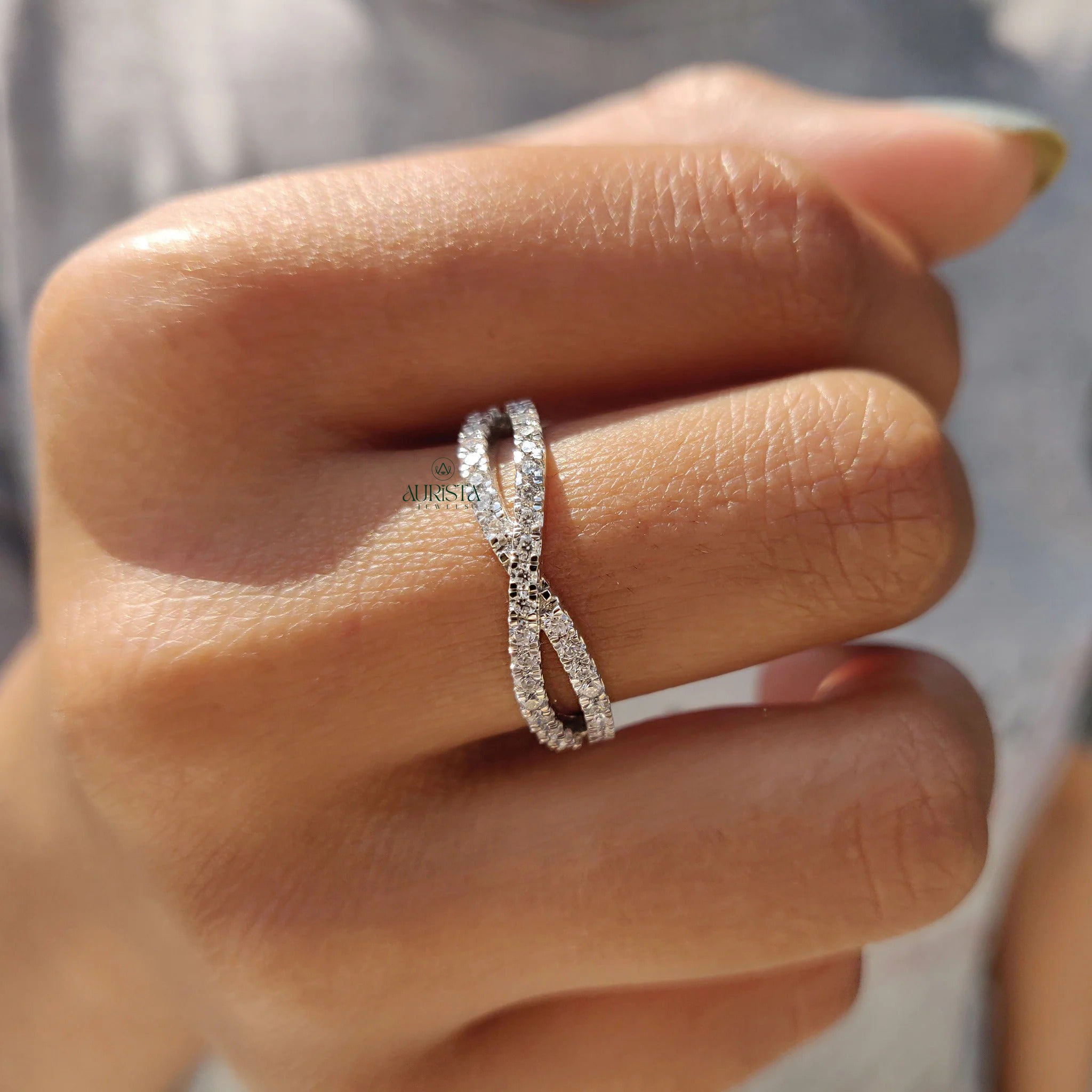 Moissanite and Diamond Crisscross Pave Wedding Band in Polished White Gold Finish