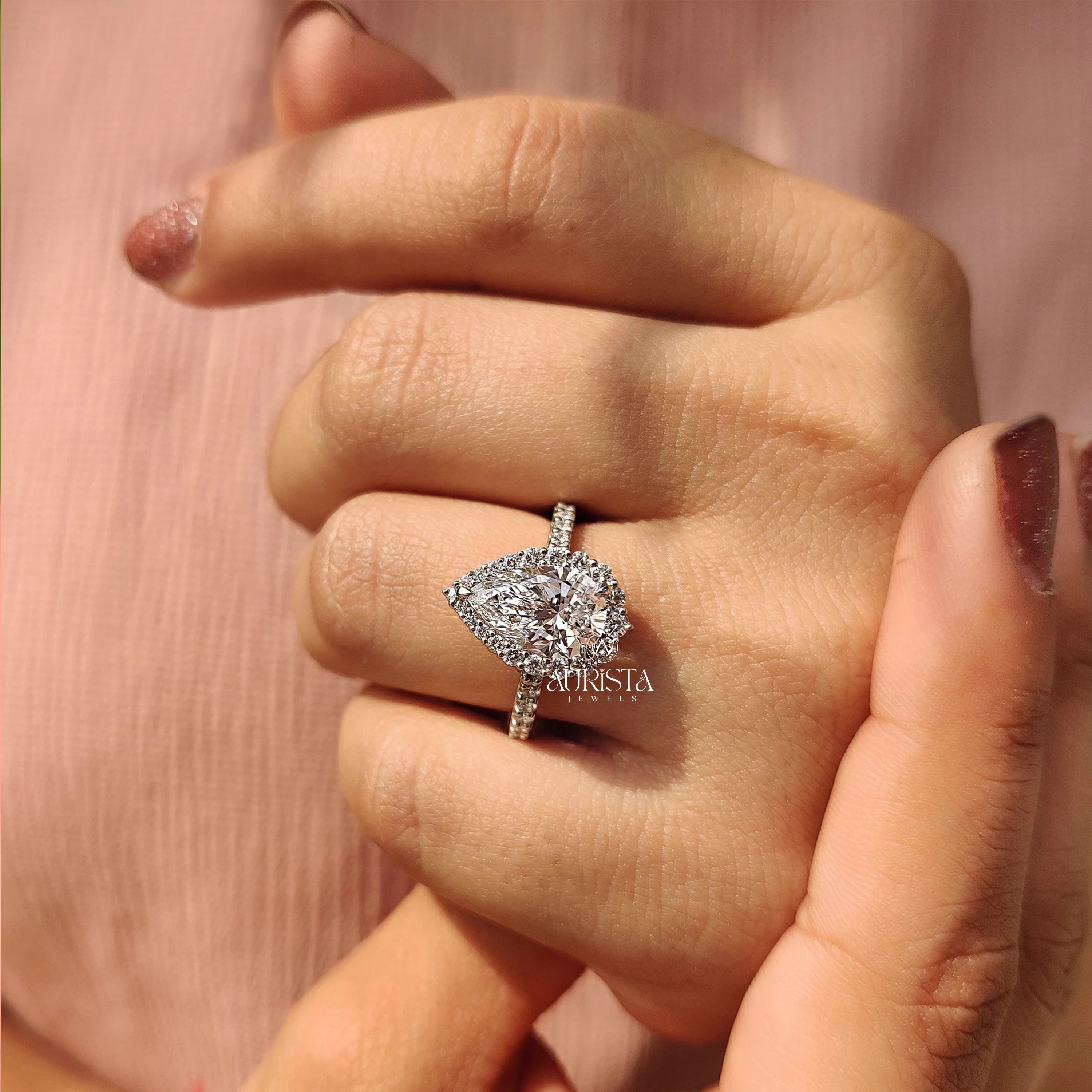 Eternal Pear Cut Halo Ring with Dazzling Side Stone Elegance