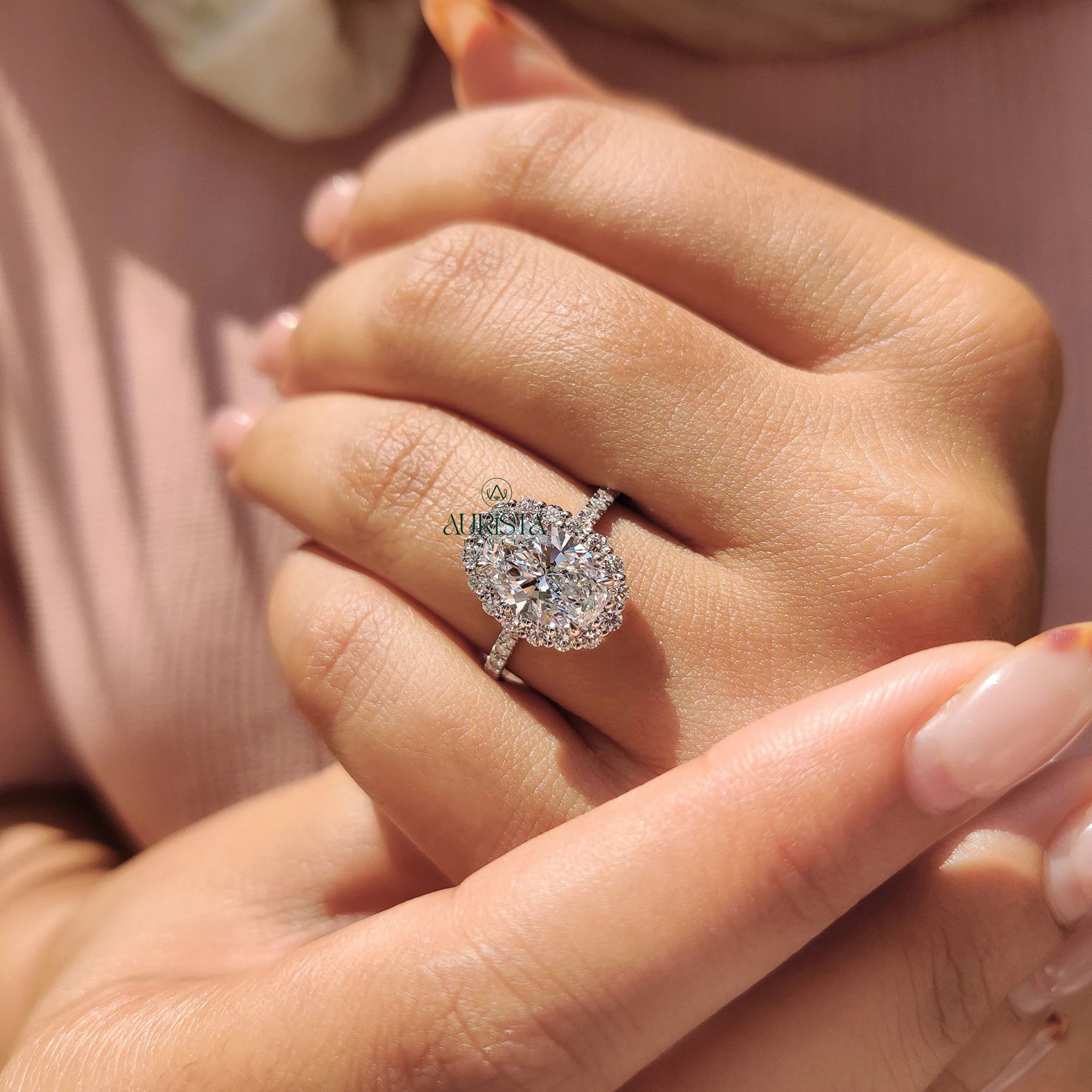 Oval Cut Diamond Halo Ring with Twisted Infinity Band