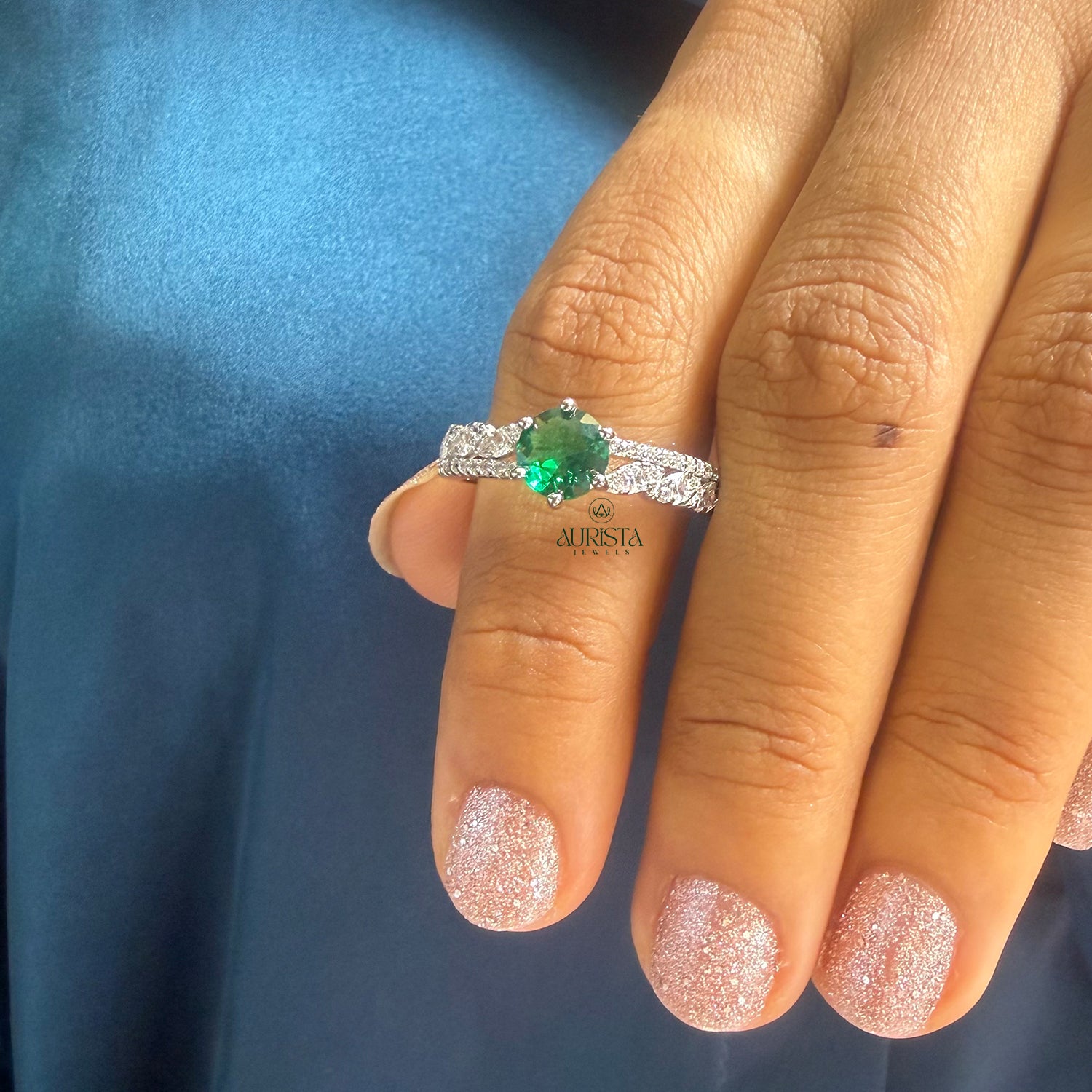 Leaf Design Ring Featuring a Green Center Stone and Sparkling White Moissanite