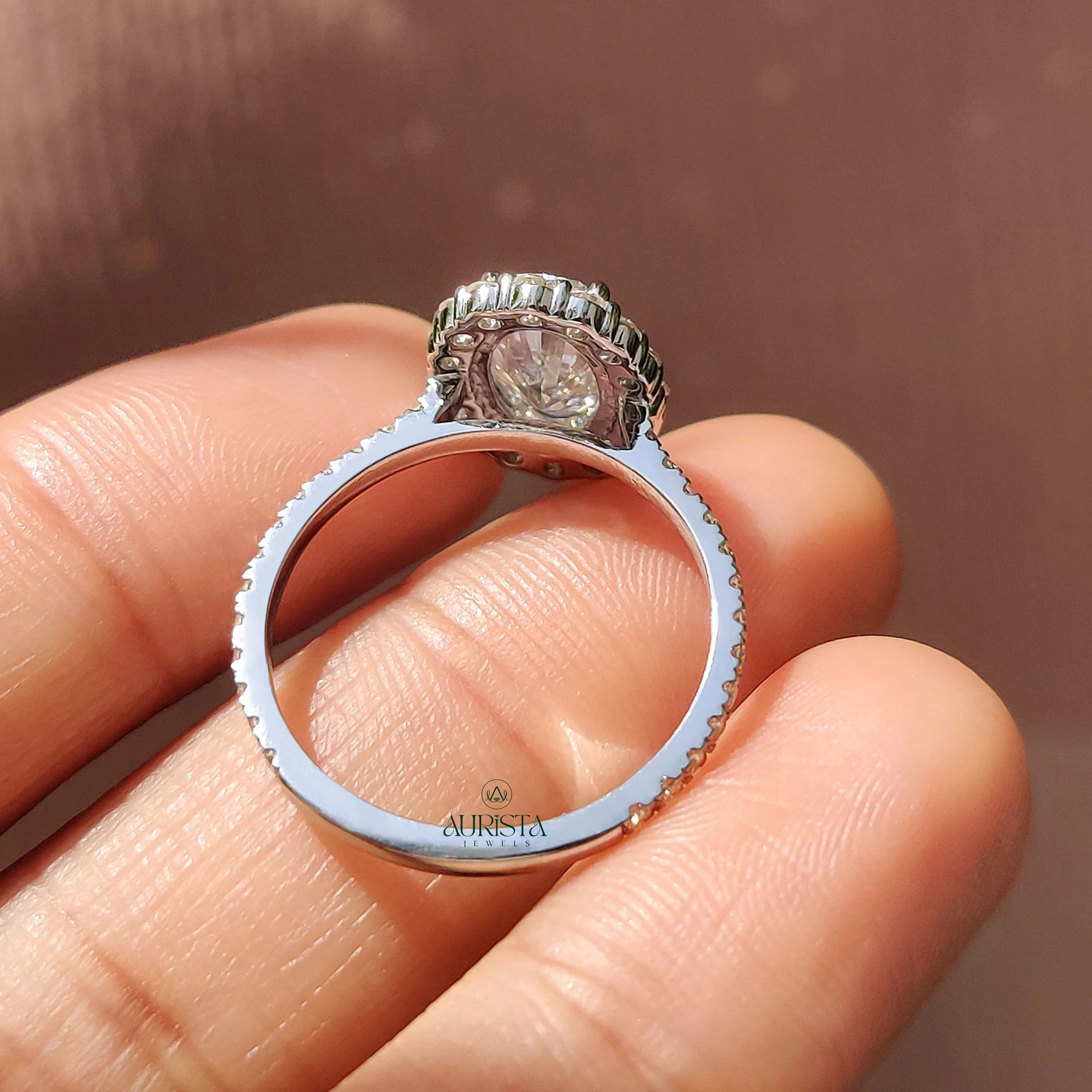 Oval Cut Diamond Halo Ring with Twisted Infinity Band