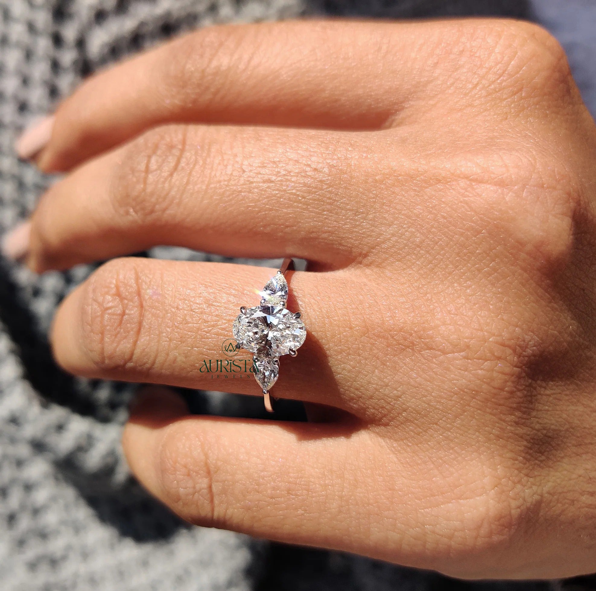 Royal Oval Cut Three Stone Ring with Brilliant Side Diamond