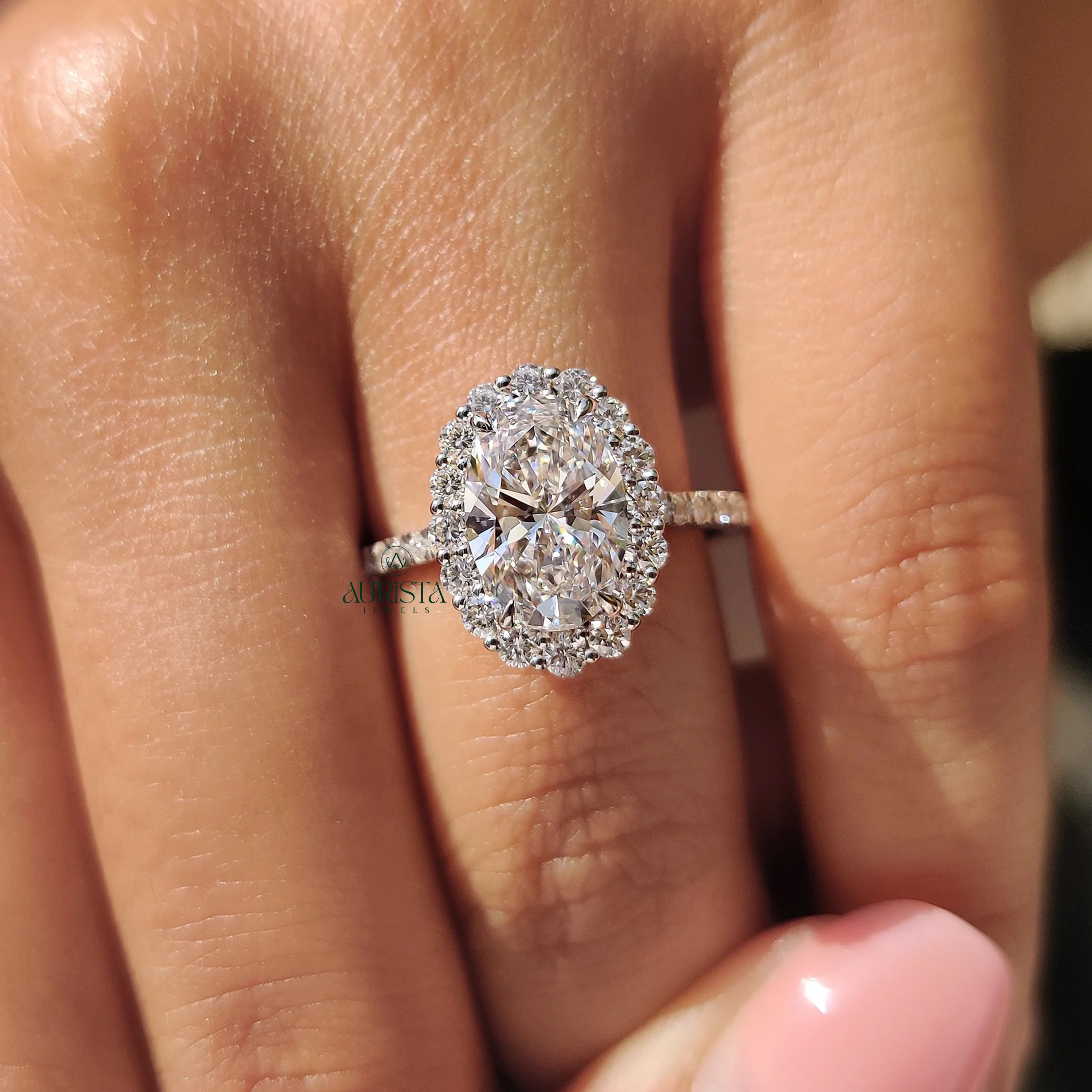 Oval Cut Diamond Halo Ring with Twisted Infinity Band