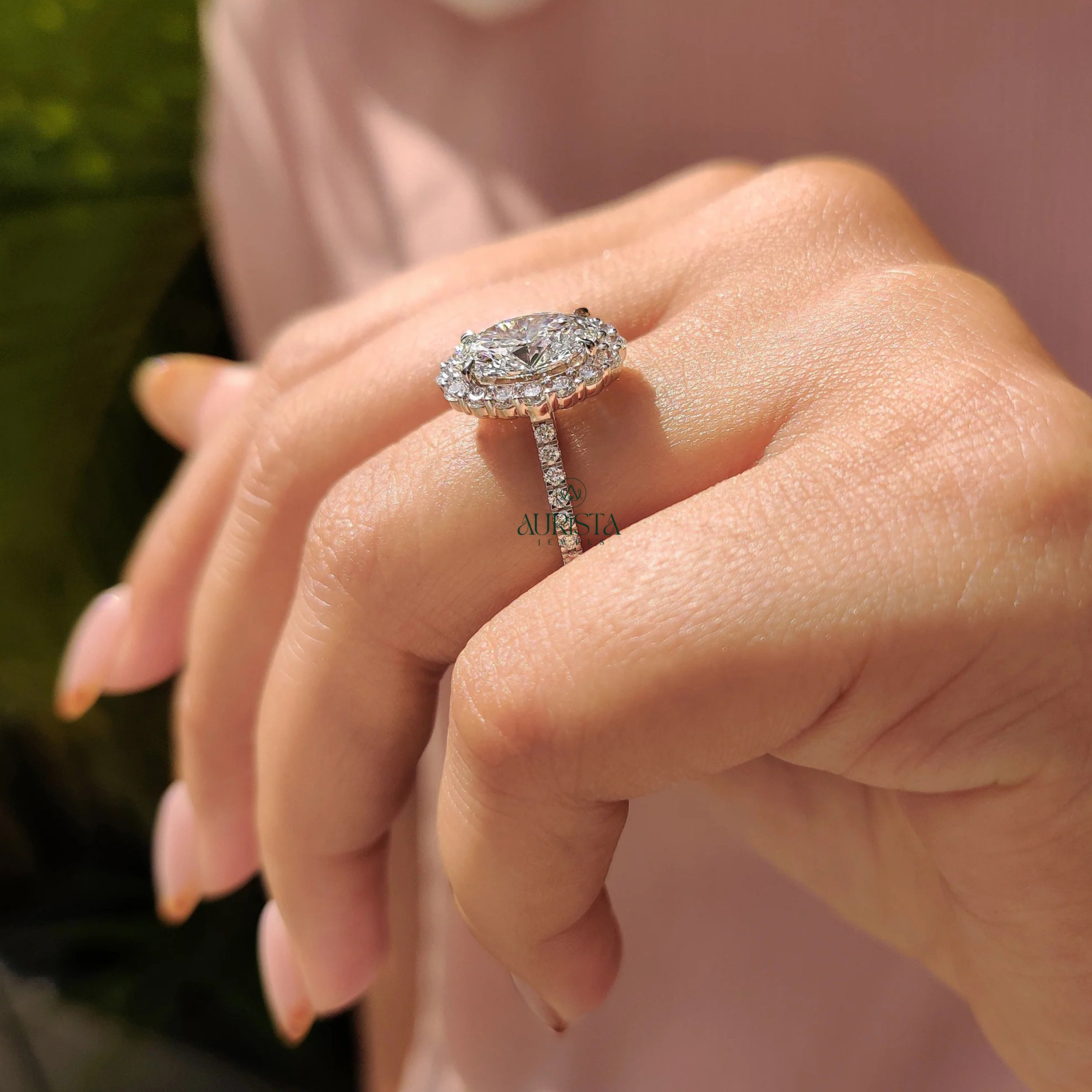 Oval Cut Diamond Halo Ring with Twisted Infinity Band
