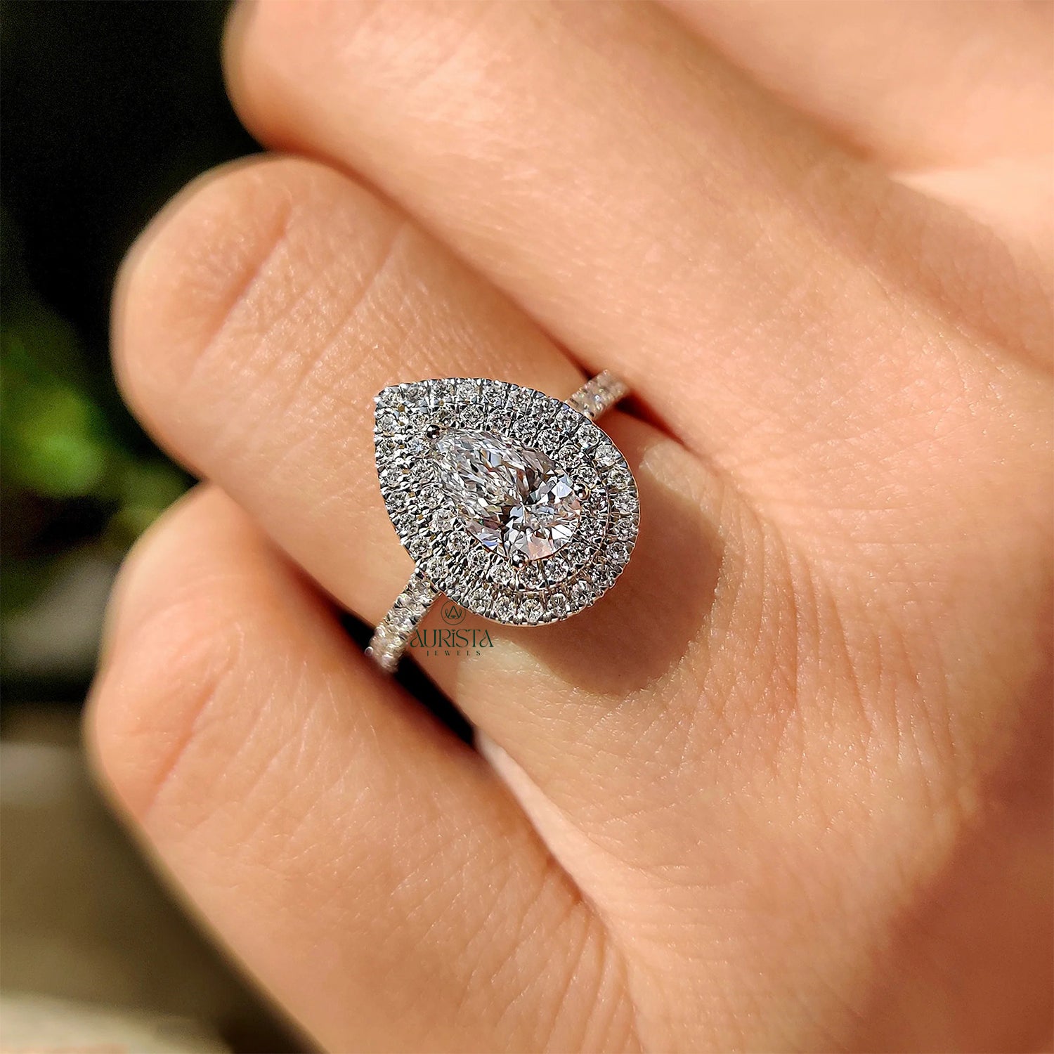 Elegant Pear Cut Ring with Sparkling Side Stones
