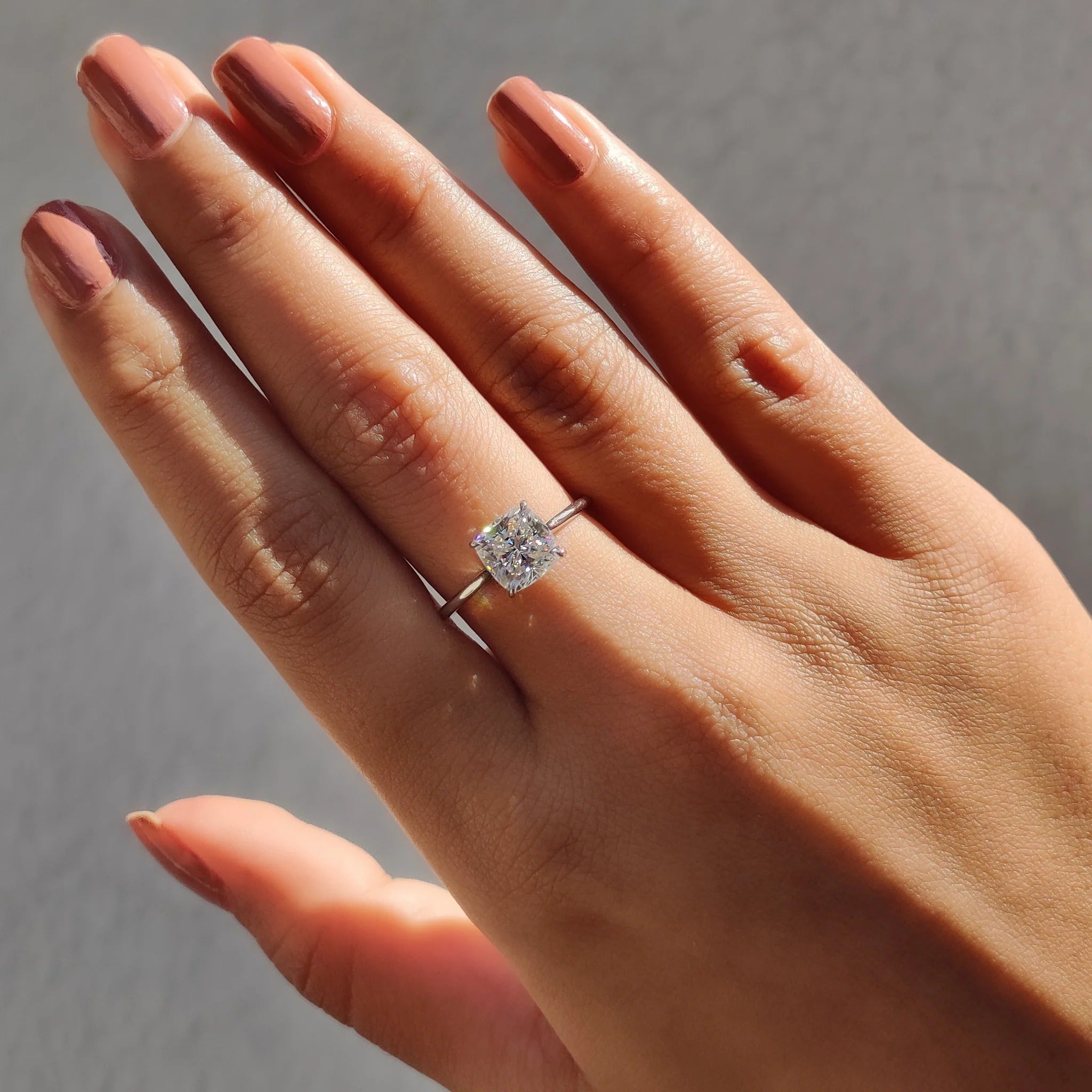 Cushion Cut Moissanite Solitaire Engagement Ring in Polished White Gold Minimalist Band