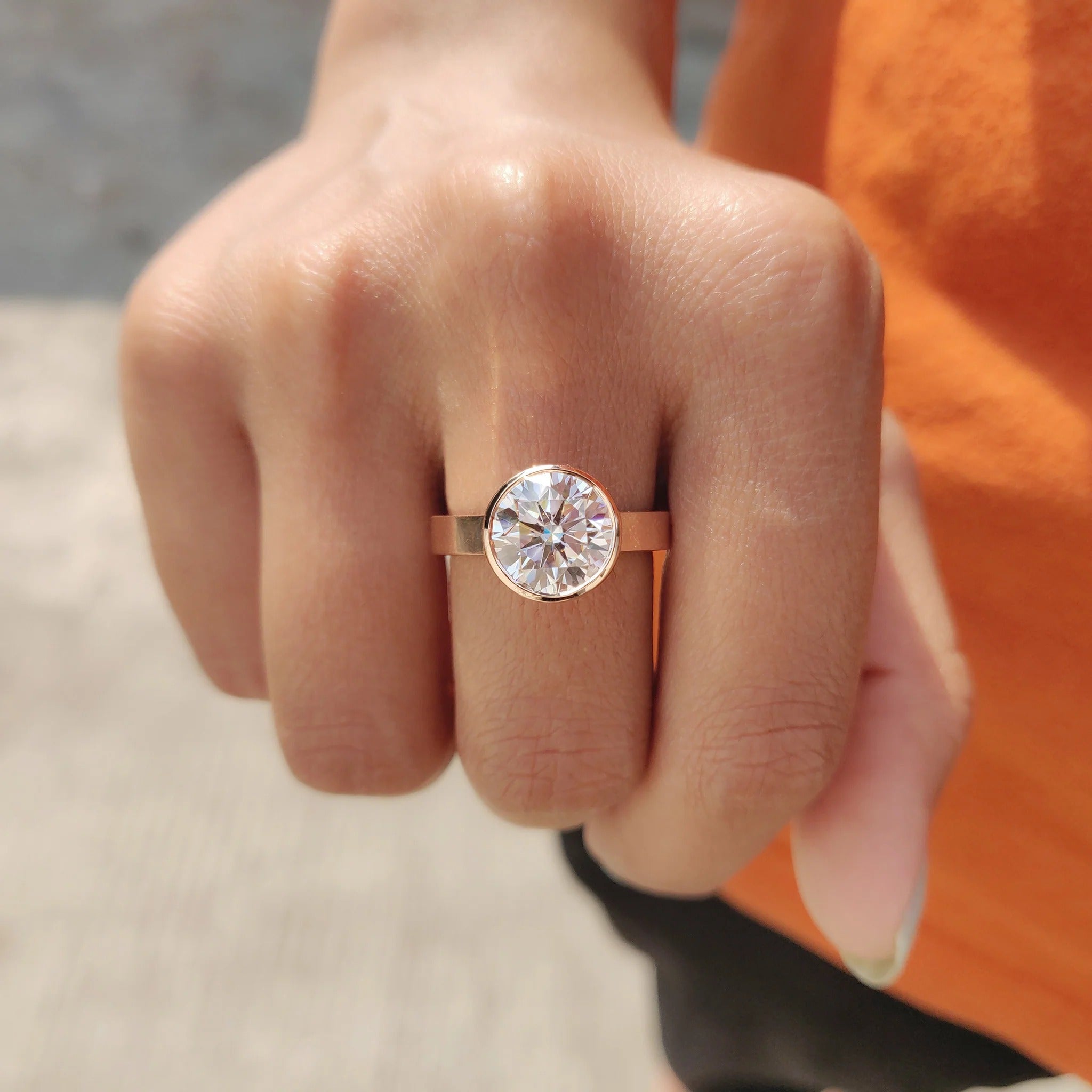 Round Cut Moissanite Bezel Set Solitaire Engagement Ring in Rose Gold Minimalist Band
