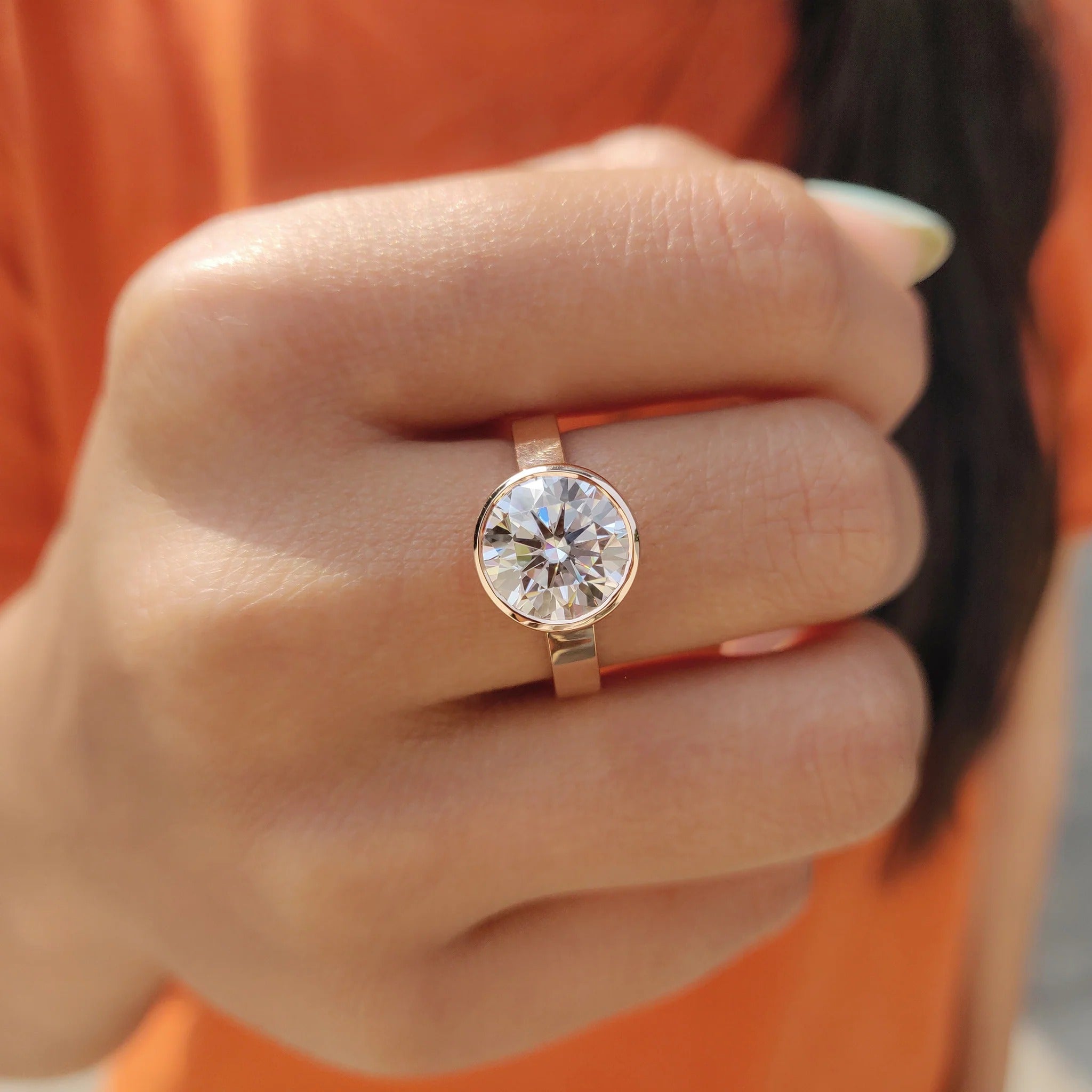 Round Cut Moissanite Bezel Set Solitaire Engagement Ring in Rose Gold Minimalist Band