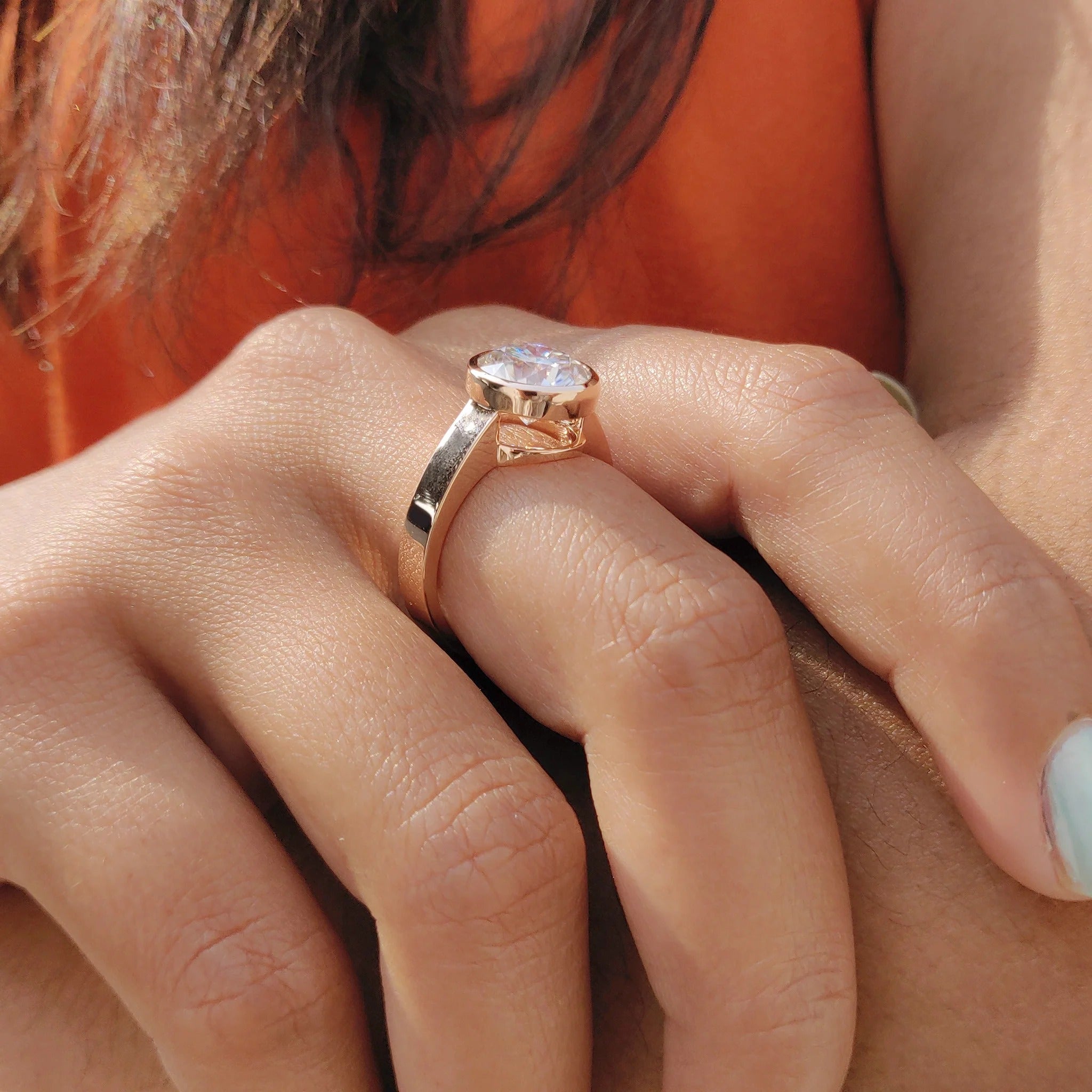 Round Cut Moissanite Bezel Set Solitaire Engagement Ring in Rose Gold Minimalist Band