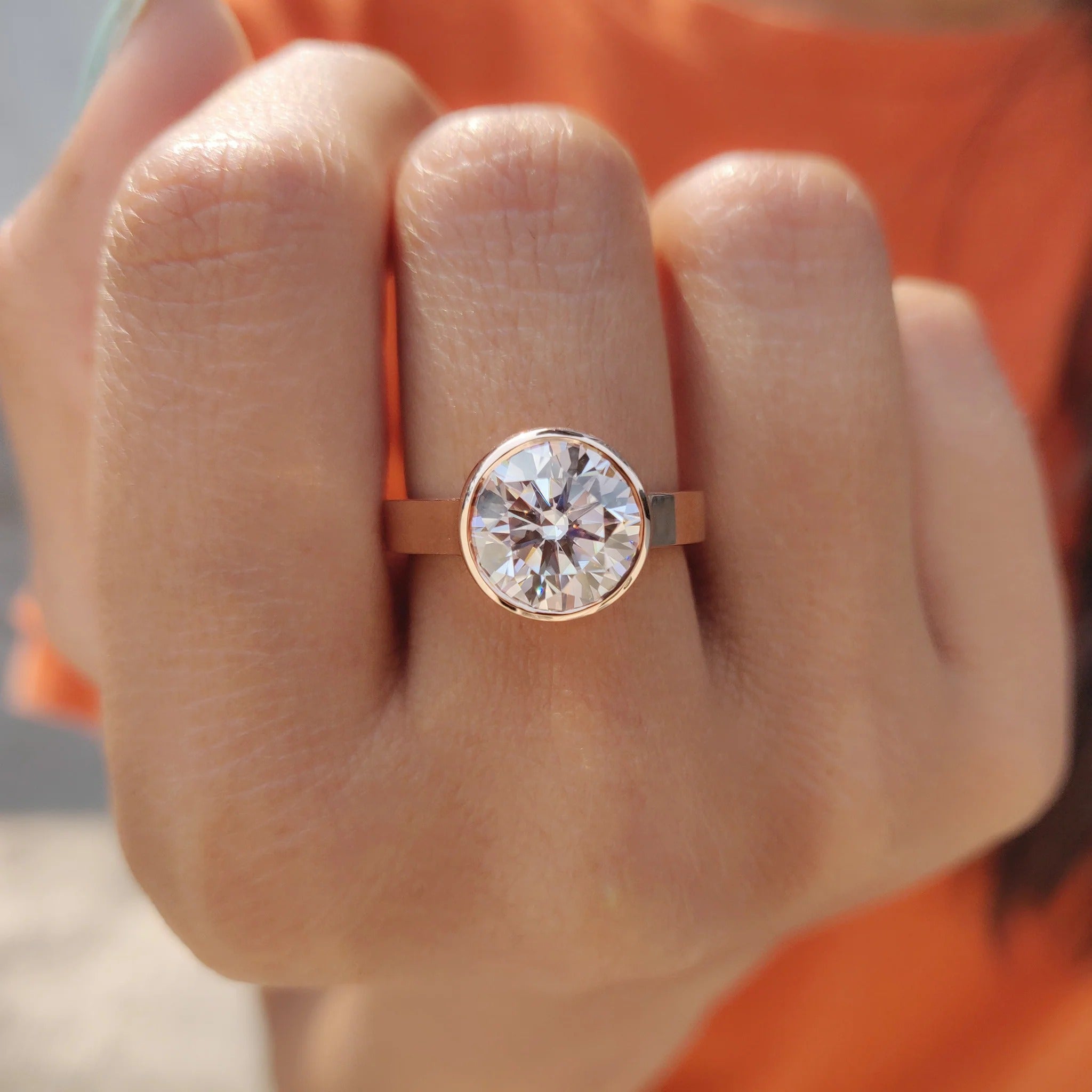 Round Cut Moissanite Bezel Set Solitaire Engagement Ring in Rose Gold Minimalist Band