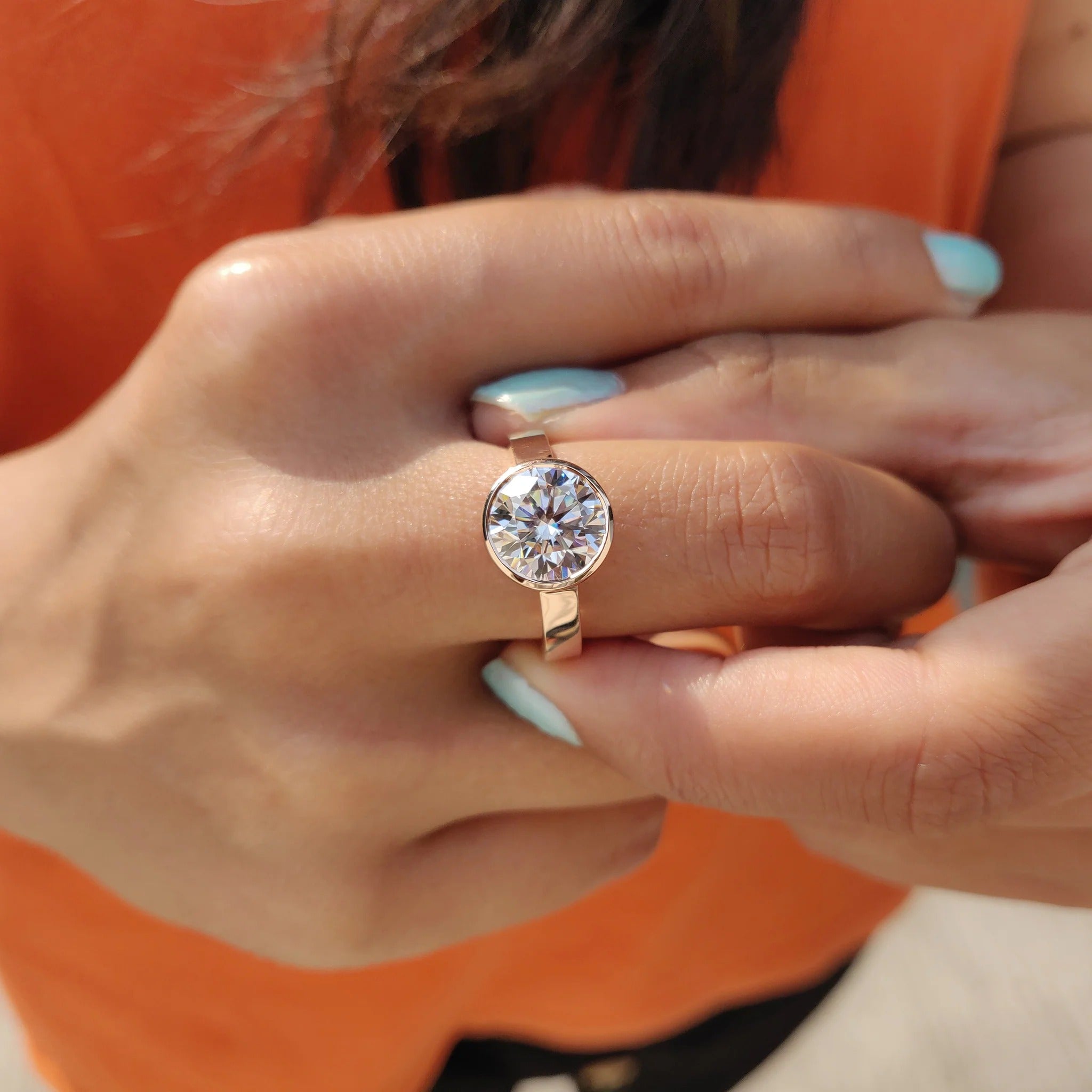 Round Cut Moissanite Bezel Set Solitaire Engagement Ring in Rose Gold Minimalist Band
