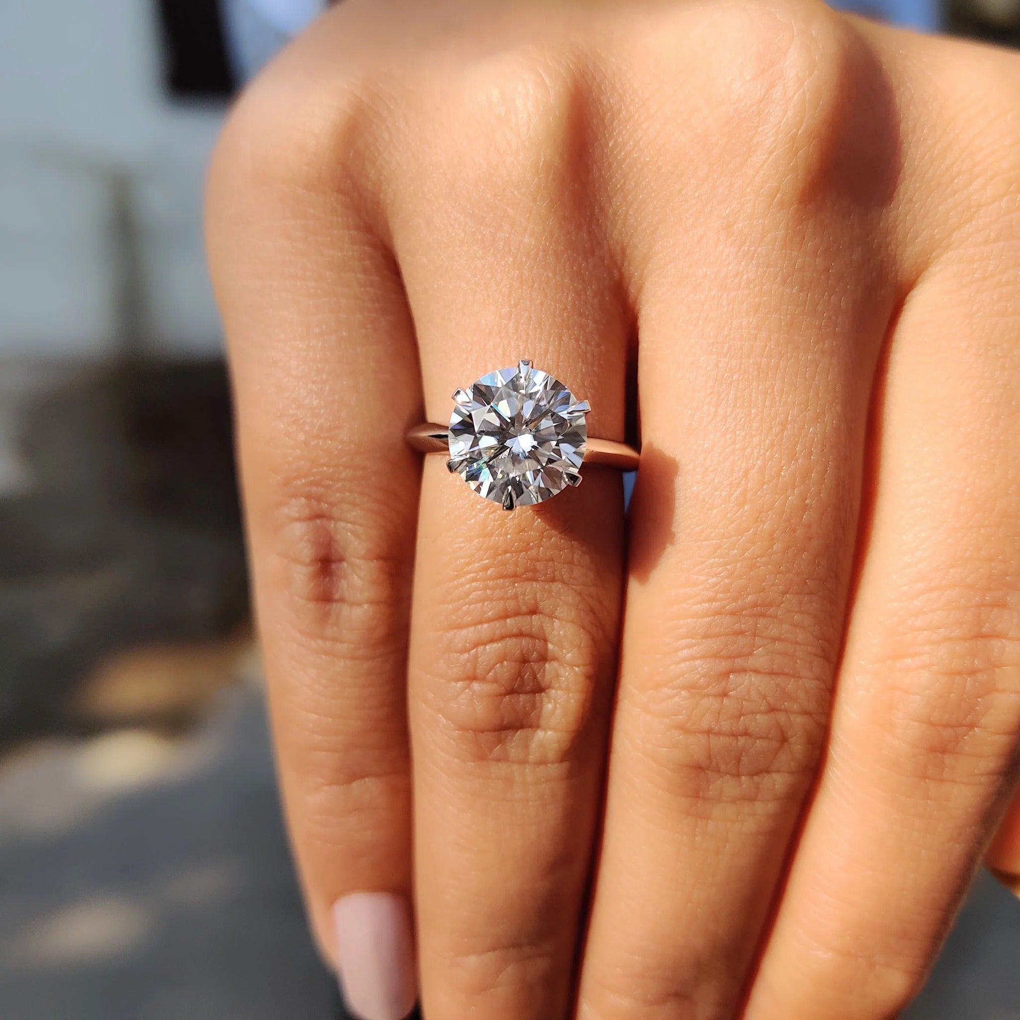 Round Cut Moissanite Solitaire Engagement Ring in Polished White Gold Band Setting