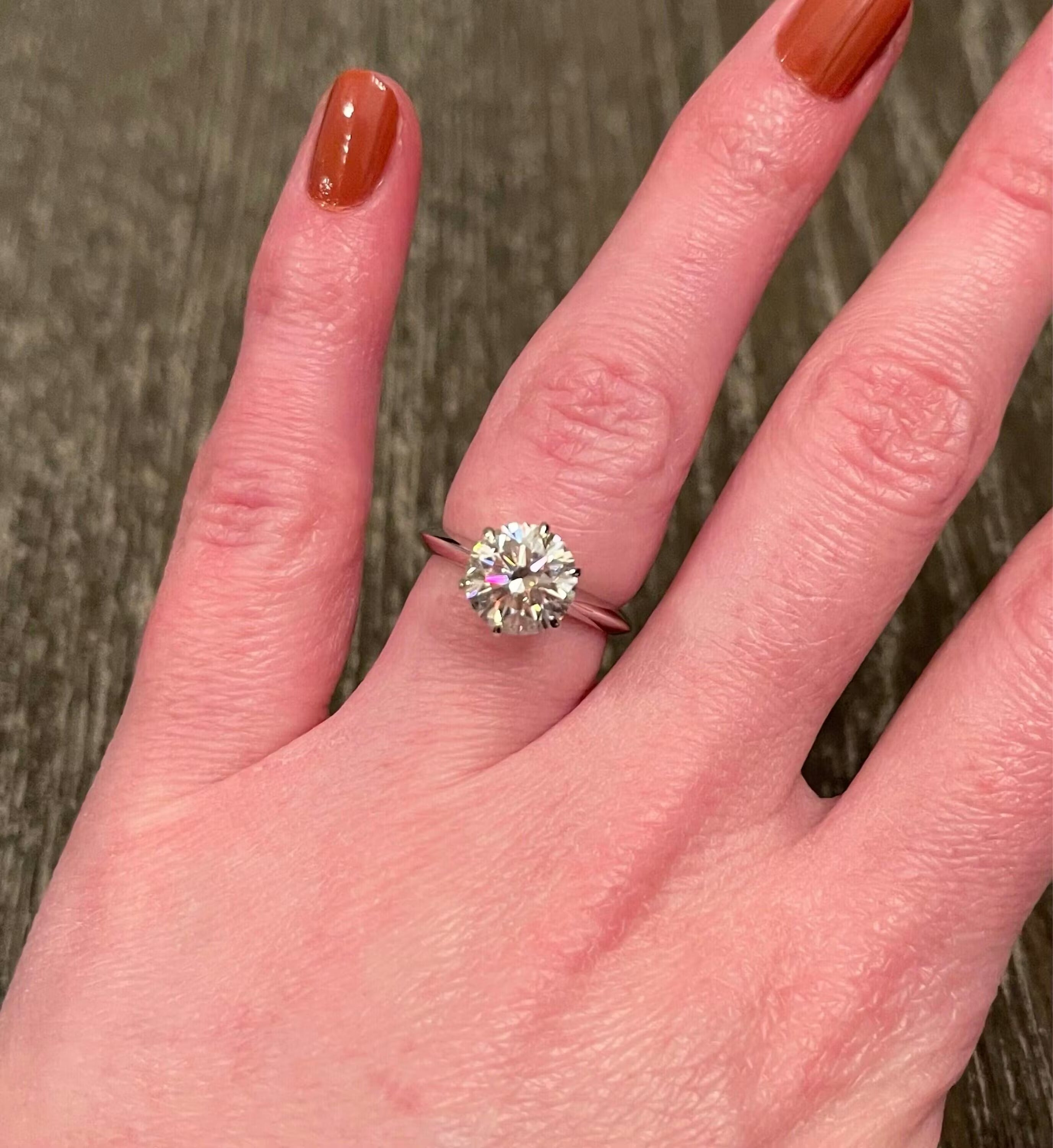 Round Cut Moissanite Solitaire Engagement Ring in Polished White Gold Band Setting