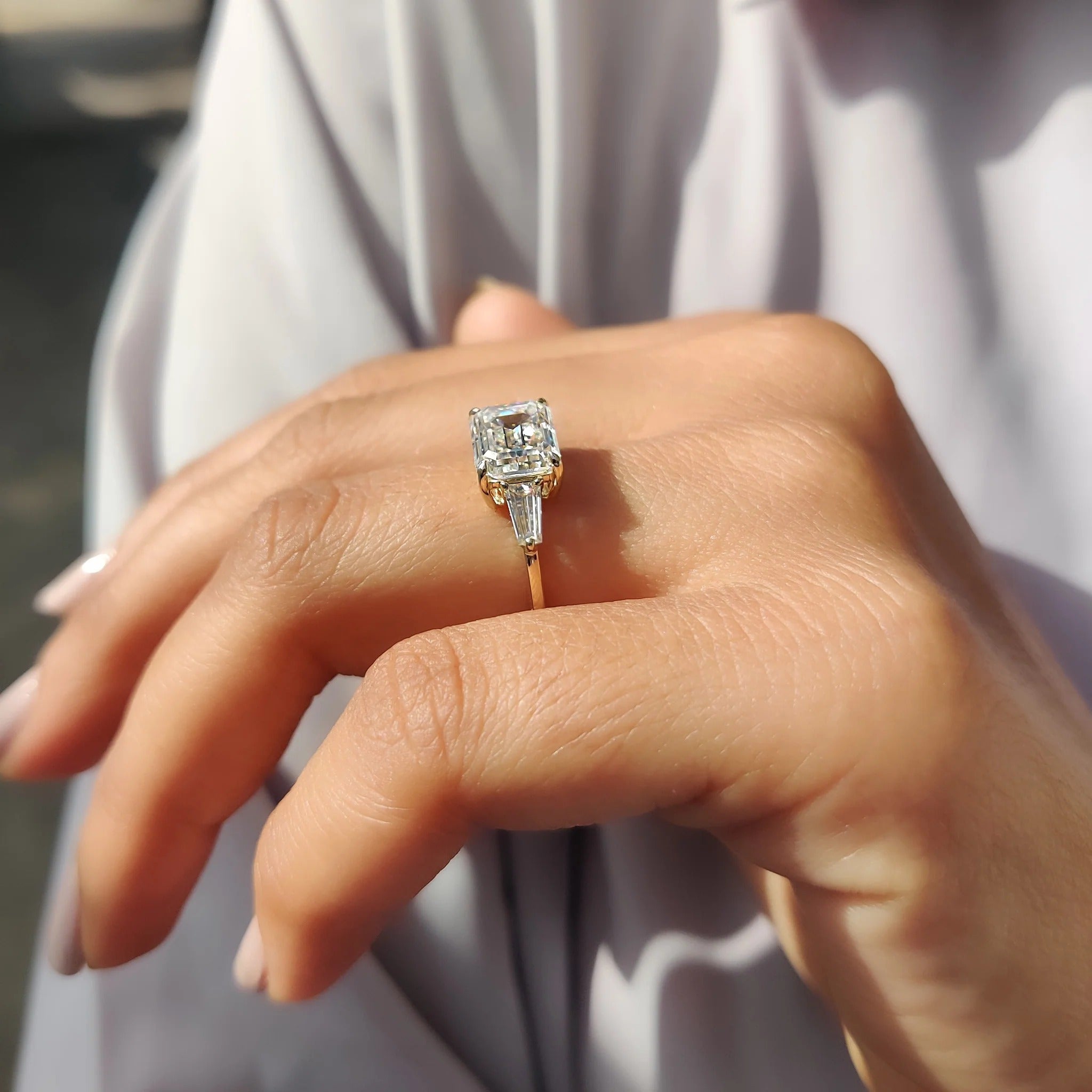 Emerald Cut Moissanite Three-Stone Engagement Ring with Tapered Baguette Side Stones