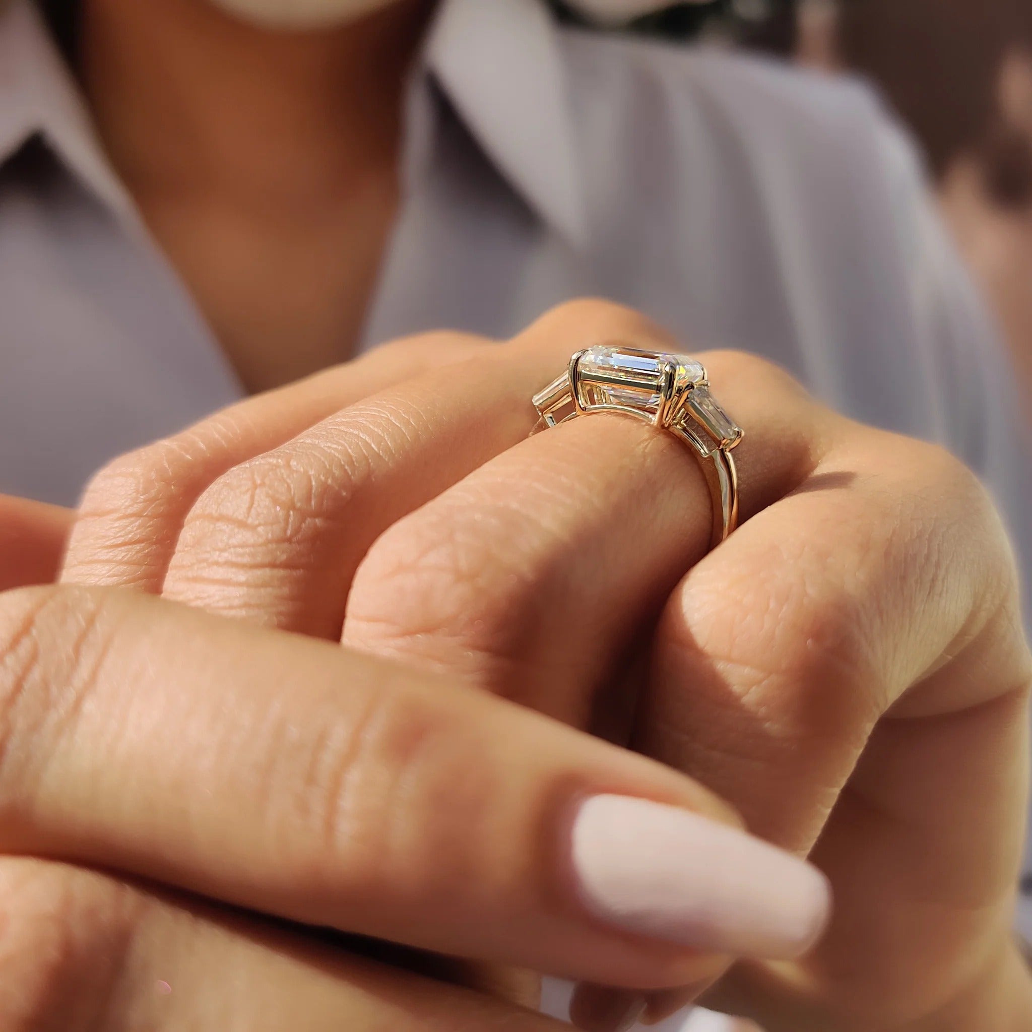 Emerald Cut Moissanite Three-Stone Engagement Ring with Tapered Baguette Side Stones