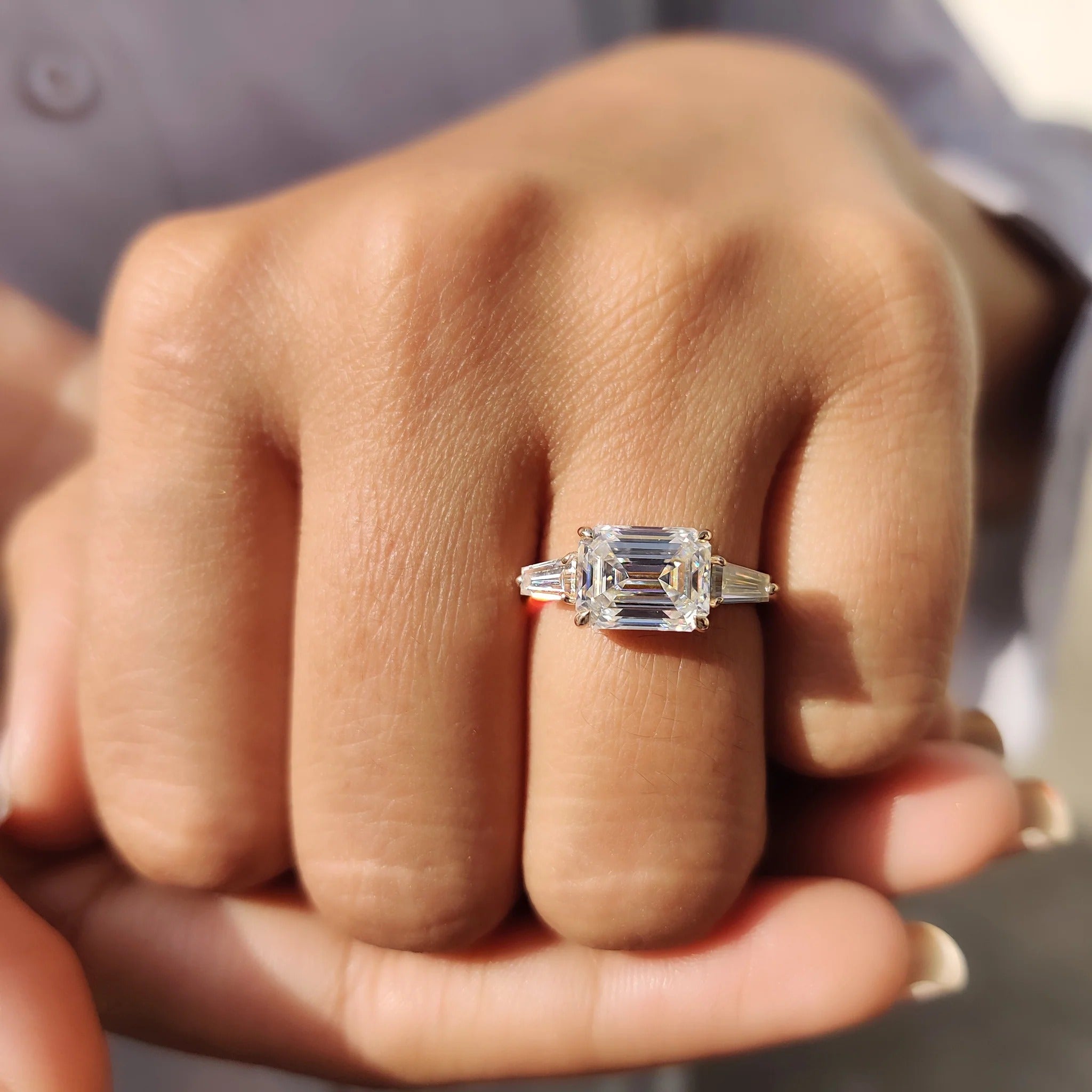 Emerald Cut Moissanite Three-Stone Engagement Ring with Tapered Baguette Side Stones