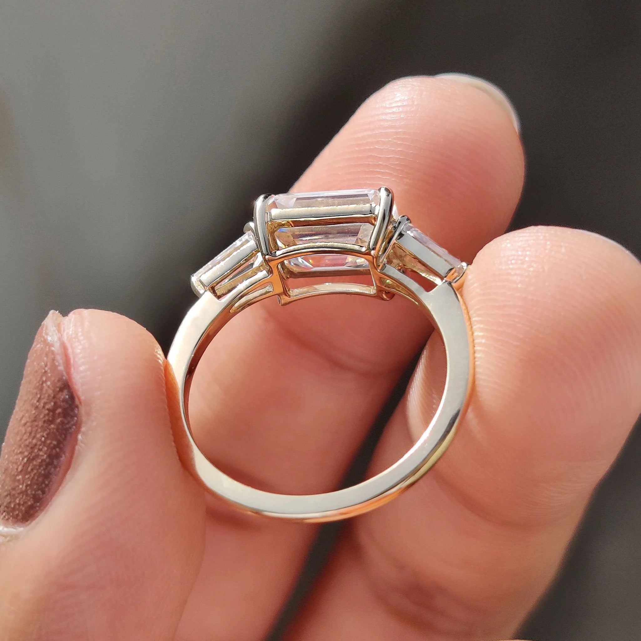 Emerald Cut Moissanite Three-Stone Engagement Ring with Tapered Baguette Side Stones