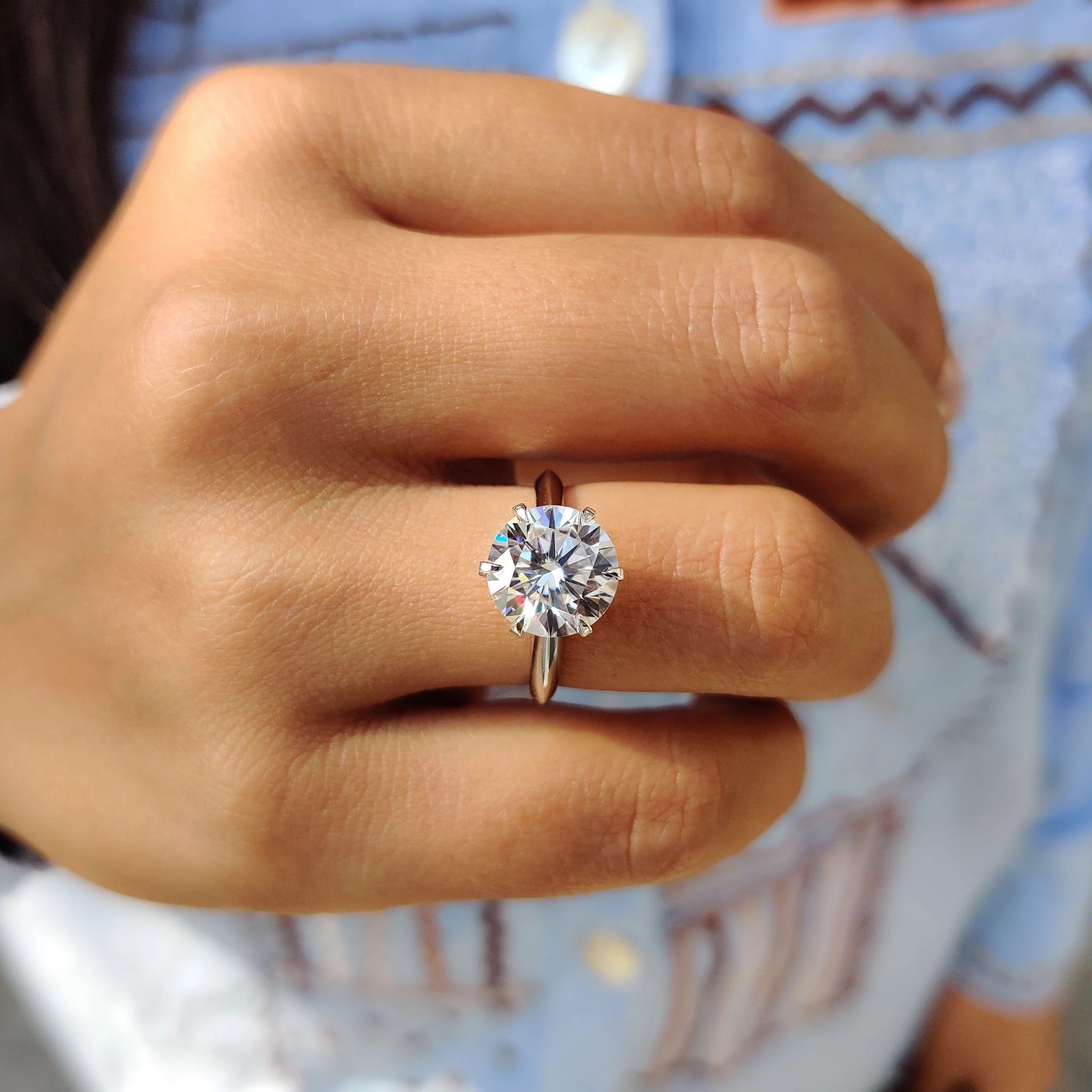 Round Cut Moissanite Solitaire Engagement Ring in Polished White Gold Band Setting