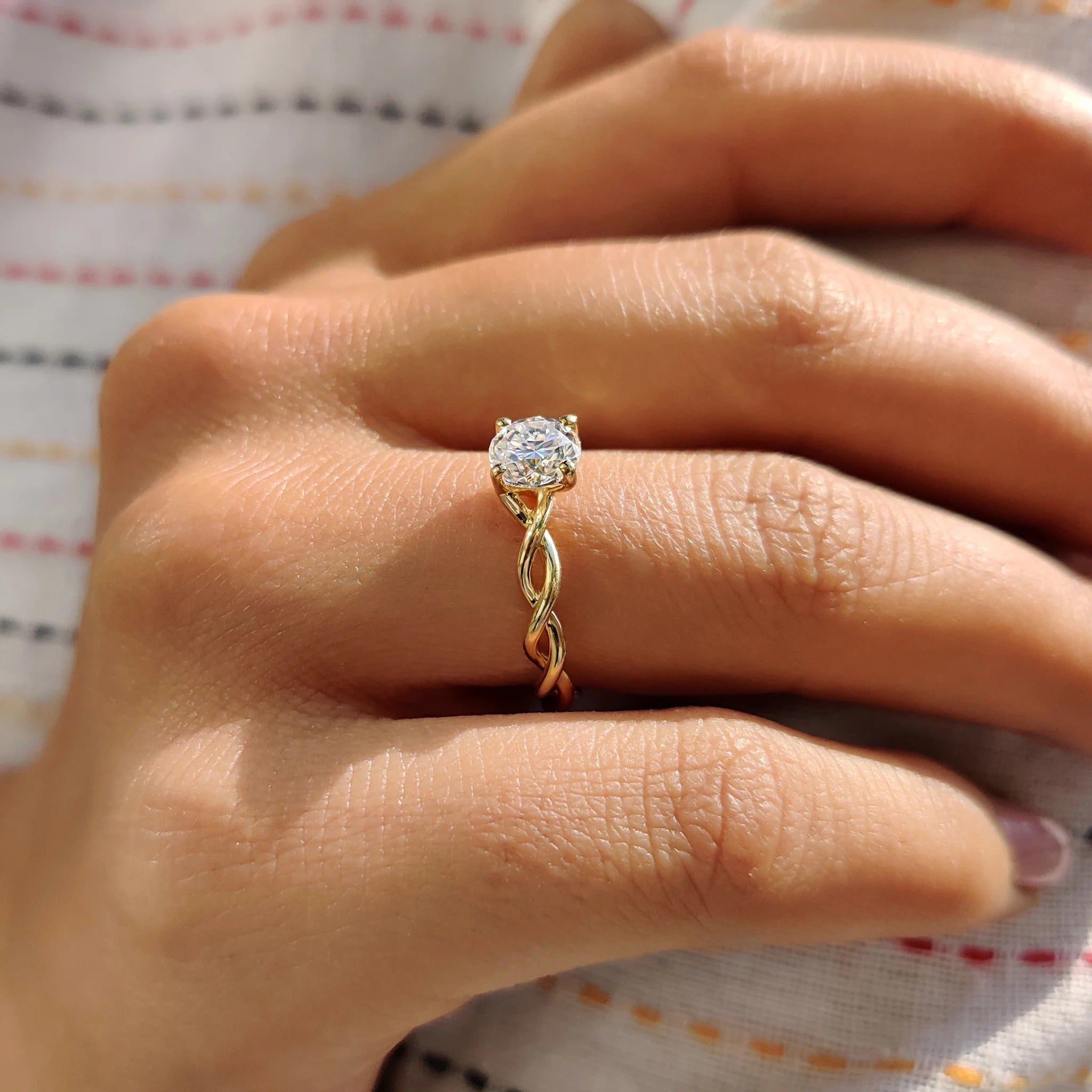 Round Moissanite Engagement Ring with Twisted Yellow Gold Band for Unique Proposals