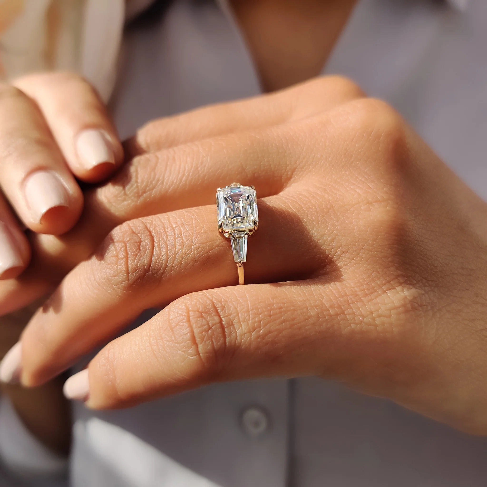 Emerald Cut Moissanite Three-Stone Engagement Ring with Tapered Baguette Side Stones