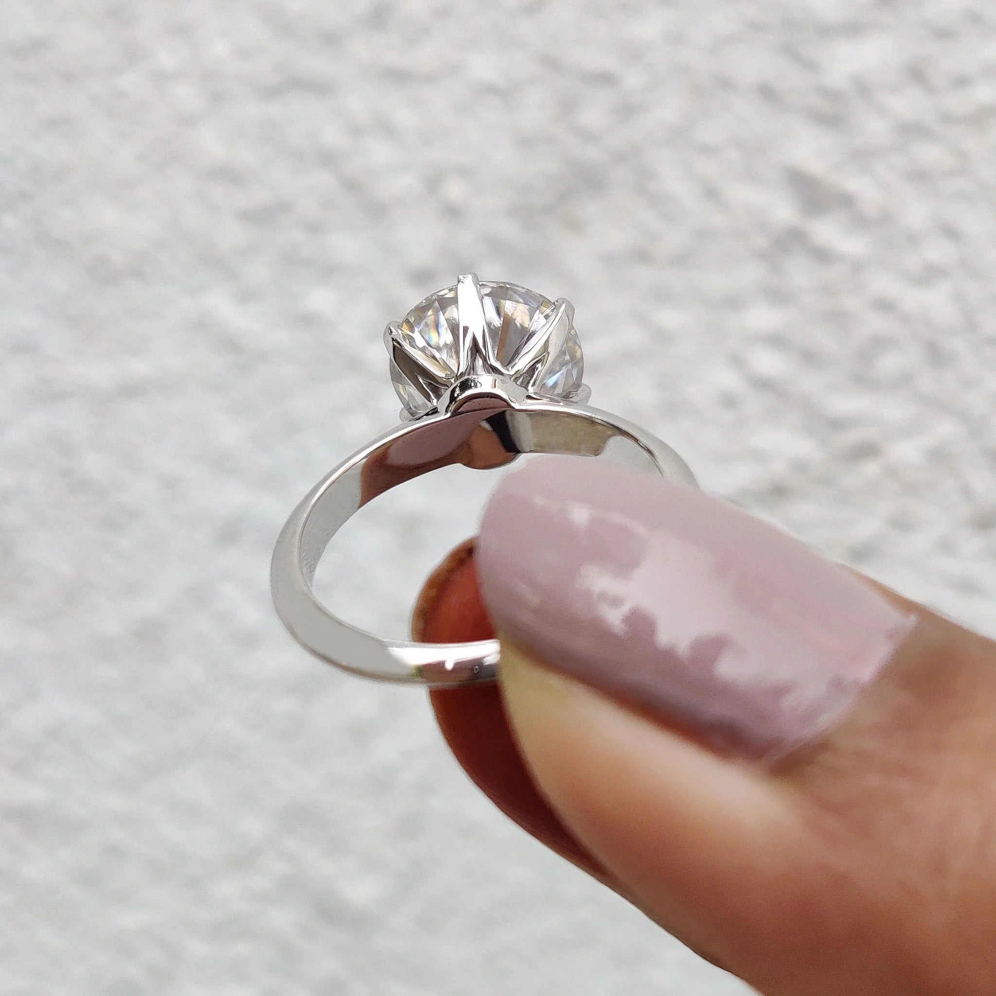 Round Cut Moissanite Solitaire Engagement Ring in Polished White Gold Band Setting