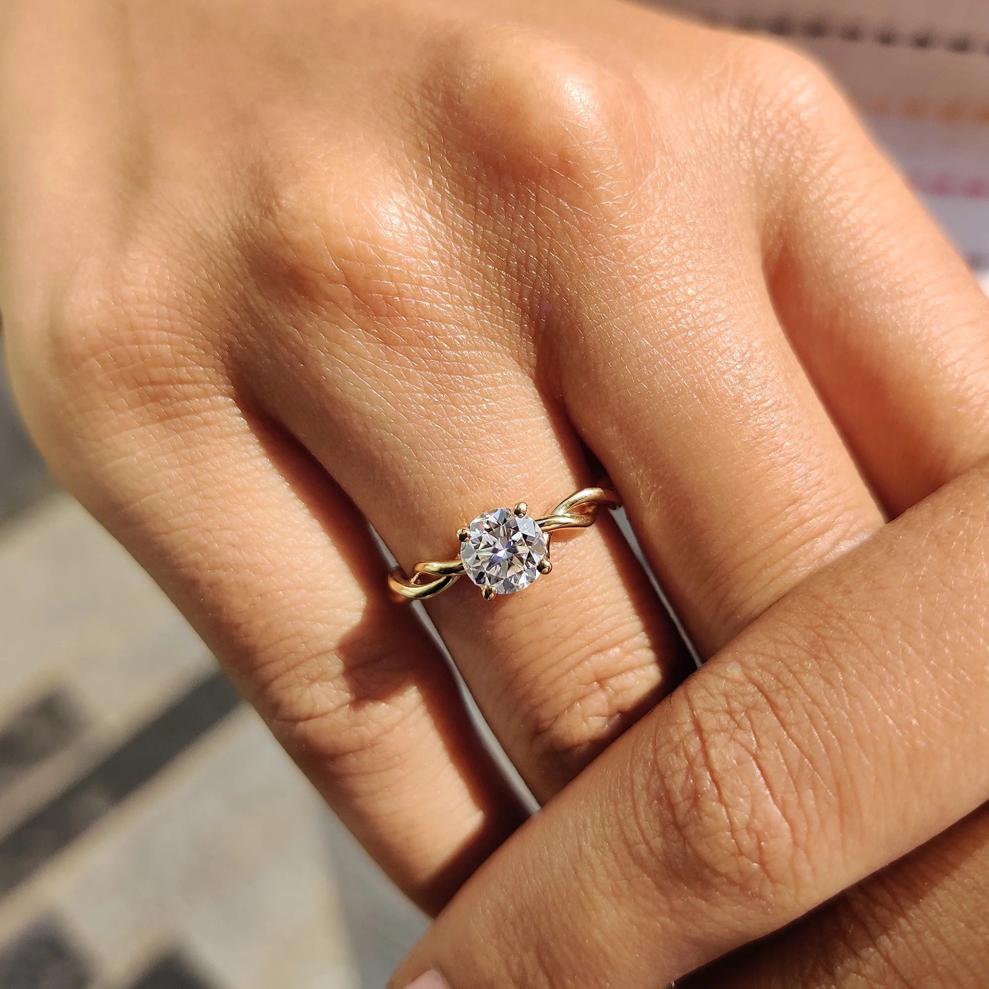 Round Moissanite Engagement Ring with Twisted Yellow Gold Band for Unique Proposals