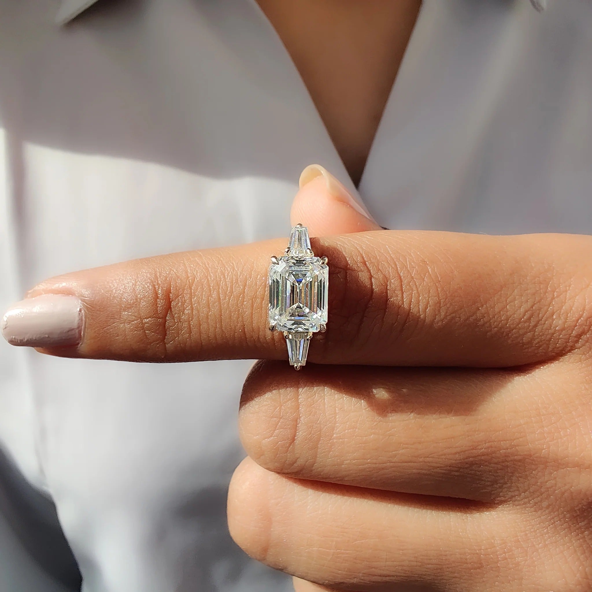 Emerald Cut Moissanite Three-Stone Engagement Ring with Tapered Baguette Side Stones